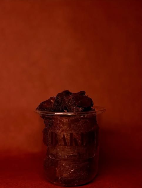 Brownie jar on a rust background