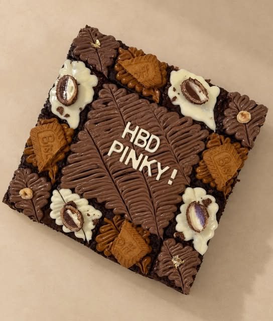 Square brownie slab reading HBD Pinky