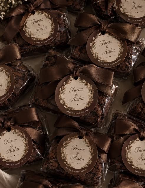 Brownies wrapped with brown ribbon and name tags
